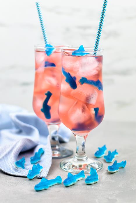 two completed shark attack punch cocktails. 