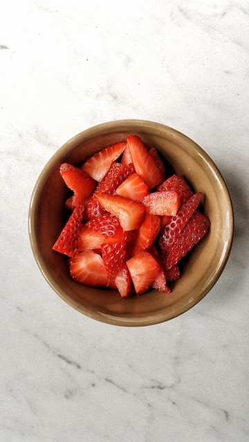 strawberry pieces in a small bowl on a table