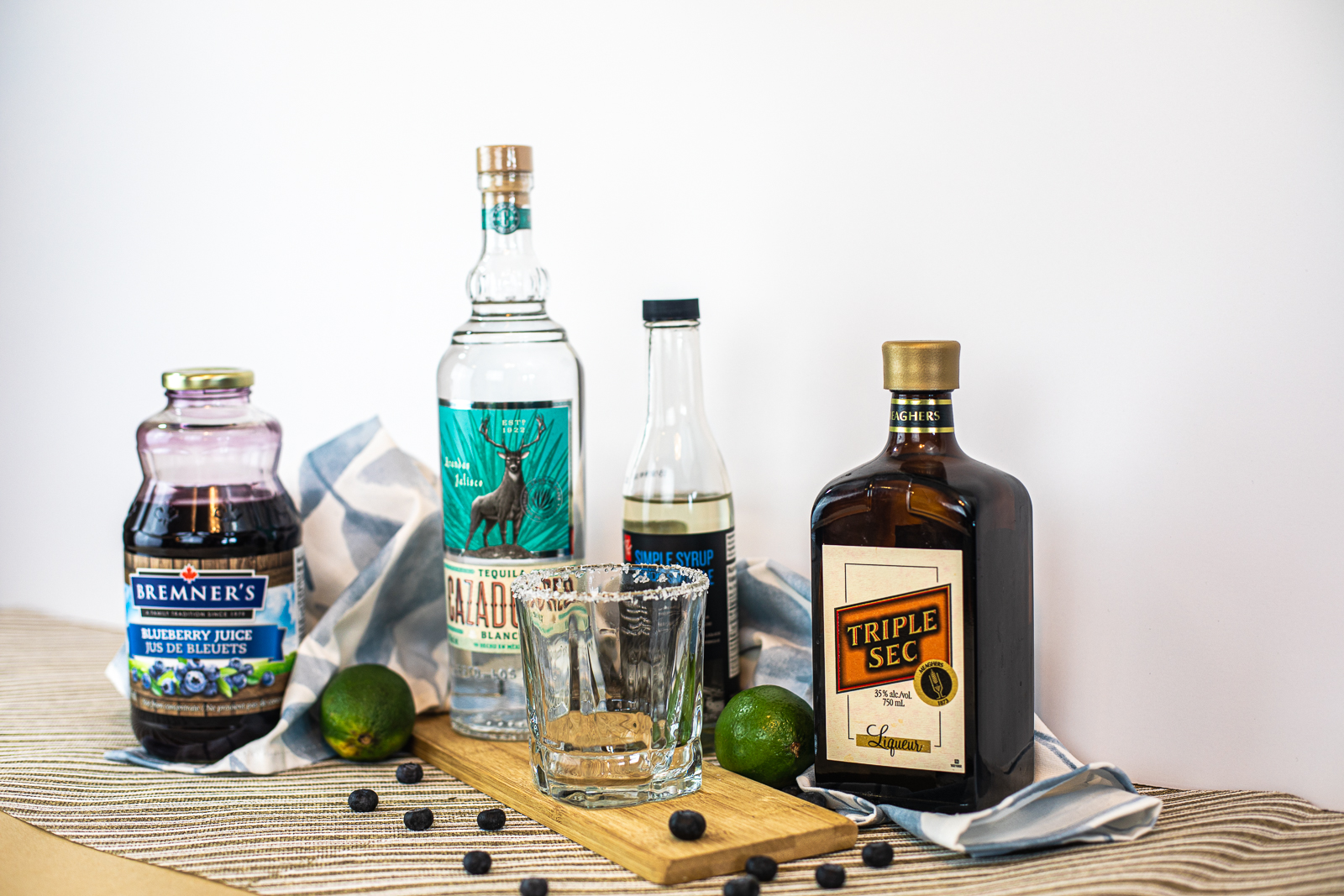 Ingredients needed: blueberry juice, tequila, triple sec, lime juice, and simple syrup. 