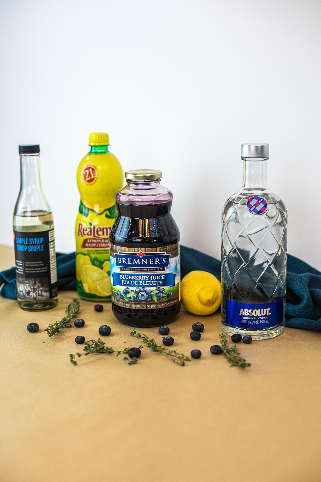 Ingredients required to make a Blueberry Thyme Cocktail. 