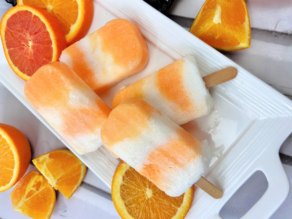 Cool Down This Summer with Boozy Orange Creamsicle Popsicles 