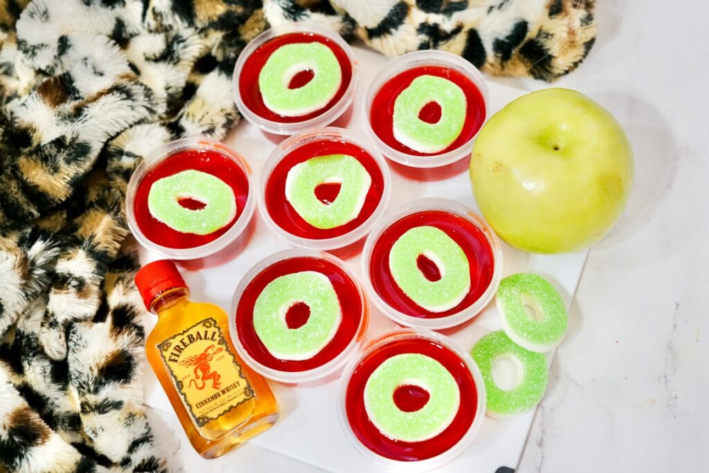 Cinnamon Cranberry Apple Jello Shots - above view of shots with candy rings as garnish 