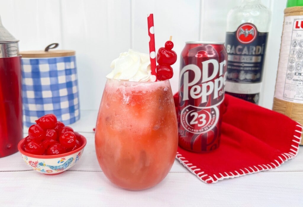Dirty Dr. Pepper Frozen Rum Slush - bowl of cherries and a can of dr. pepper. 