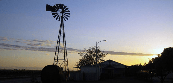 Windmill at sunset at Englemann cellars in Fresno, CA