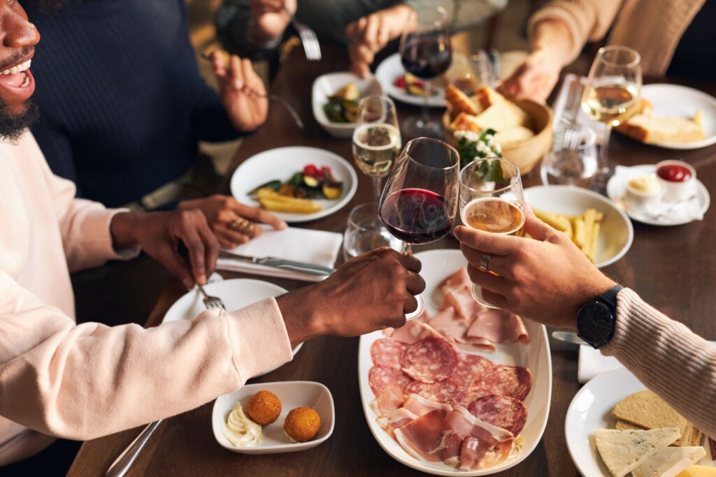 Friends enjoying wine and food together