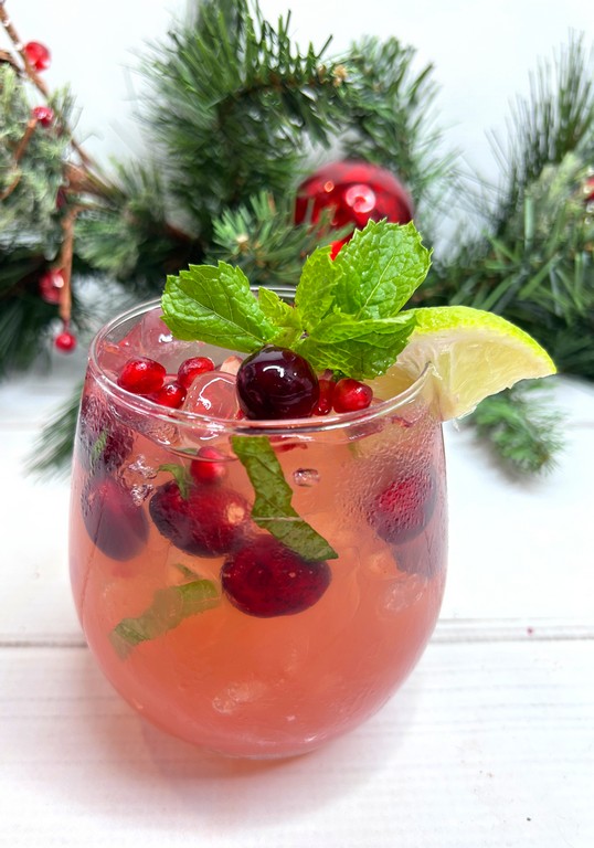 Cocktail garnished with tasty holiday treats 