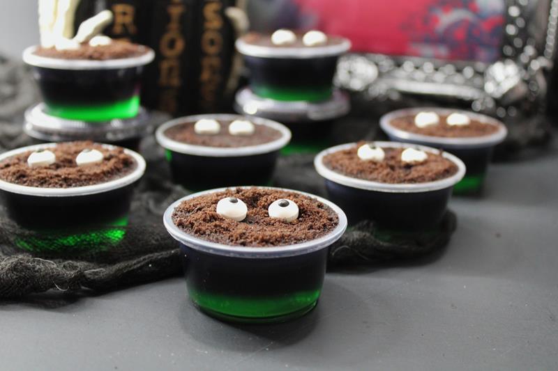 jeepers creepers jello shots with chocolate crumble and candy eyes