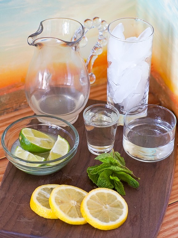 Lemonade Mojito - Clear glasses filled with ingredients and ice. 