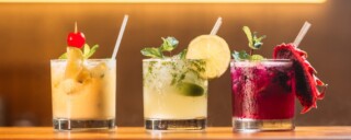Non-Alcoholic Drinks - 3 glasses in a row of pretty looking cocktail juices