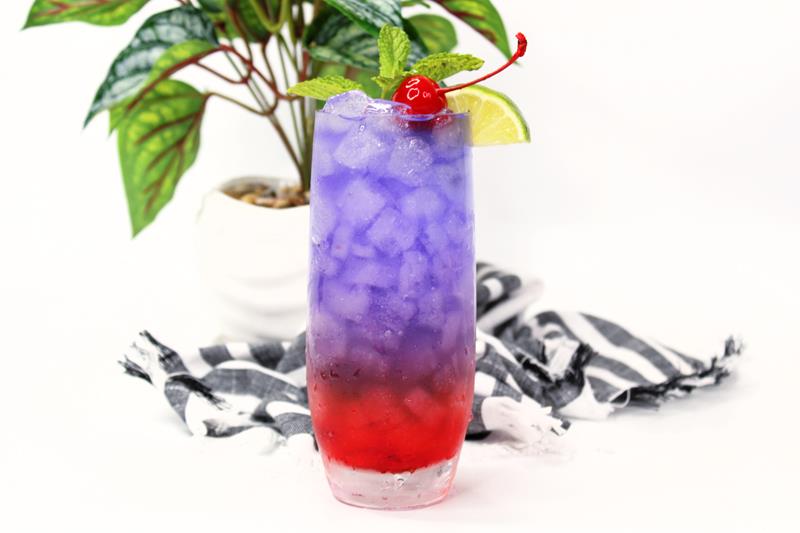 the circle purple fade cocktail recipe, tall glass with purple and red drink 