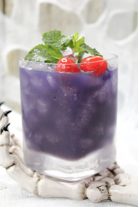 The Black Pearl Cocktail Recipe: Close up showing the dark purple drink. 