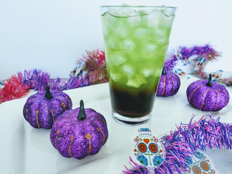 purple and green witch halloween themed mocktail no alcohol drink 