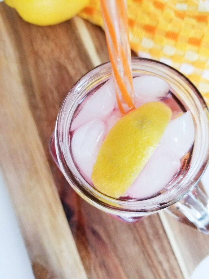 top view of drink showing lemon wedge and ice 