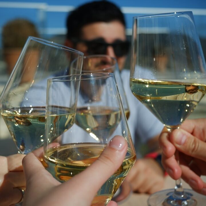 Bellina Alimentari wine bar in Atlanta picture of friends clinking wine glasses